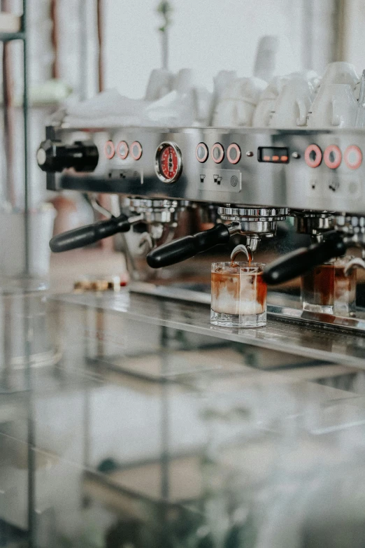 a machine full of drinks and drinking glasses