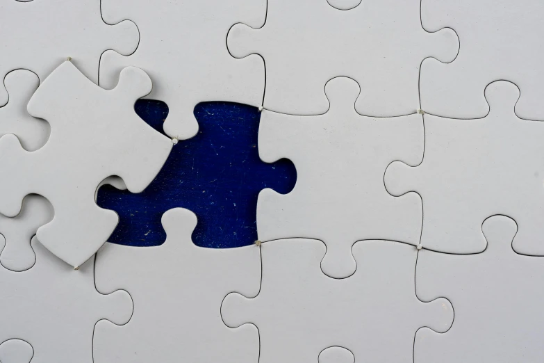 a puzzle piece that is missing from the white puzzles