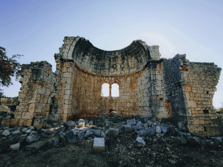 a very old ruins looking at the windows of it