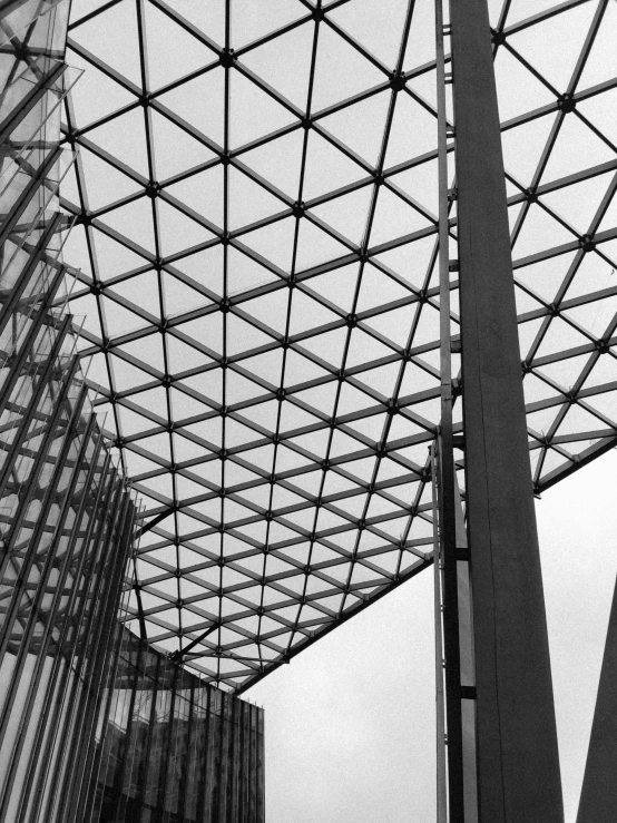 black and white pograph of architecture against a cloudy sky