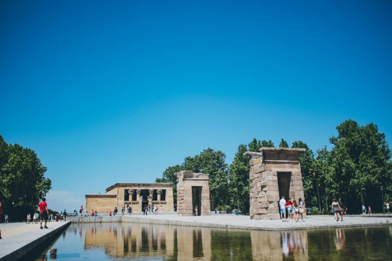 a large stone water fountain with some statues in it