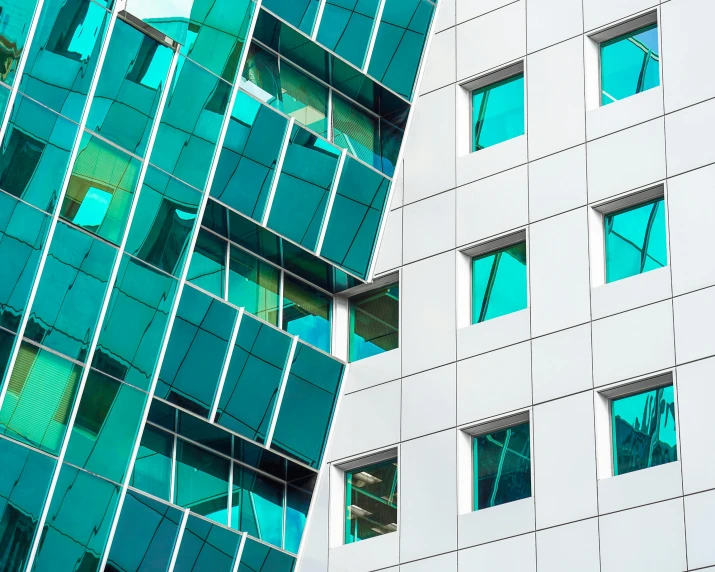 closeup of a building's windows and the colors of green