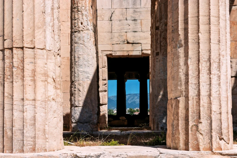 a tall stone building sitting next to a body of water