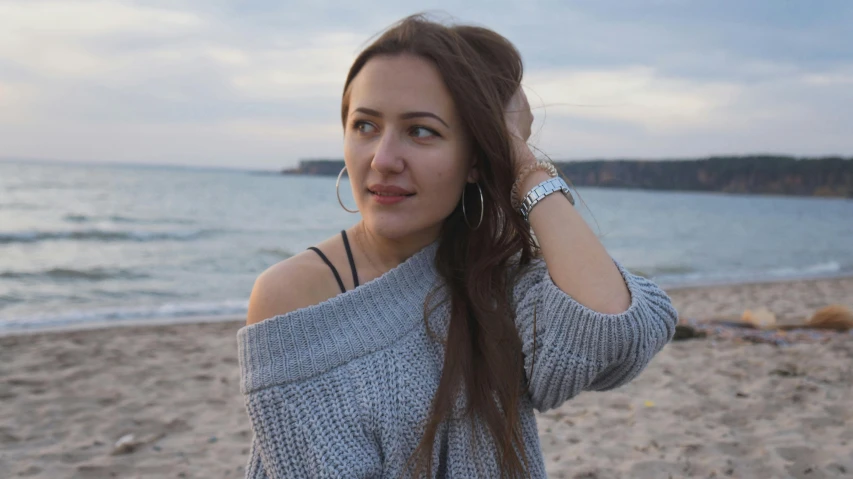 woman with earrings on looking off into the distance