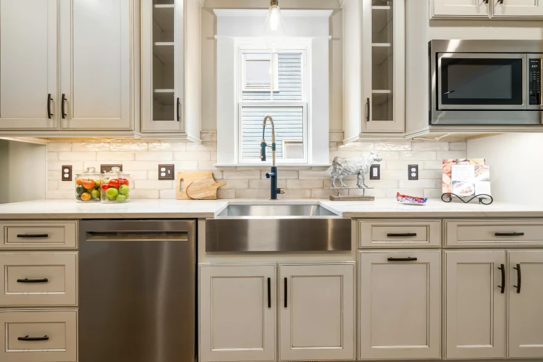 a kitchen with a window, stove and dishwasher