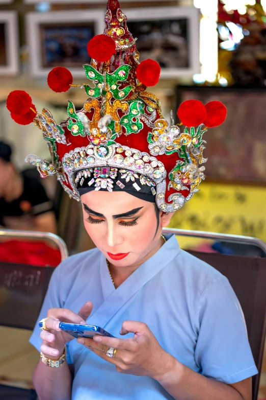 a woman dressed up with a colorfully decorated headdress