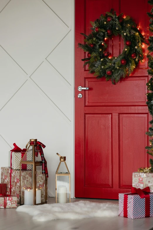 a red front door with presents in front of it