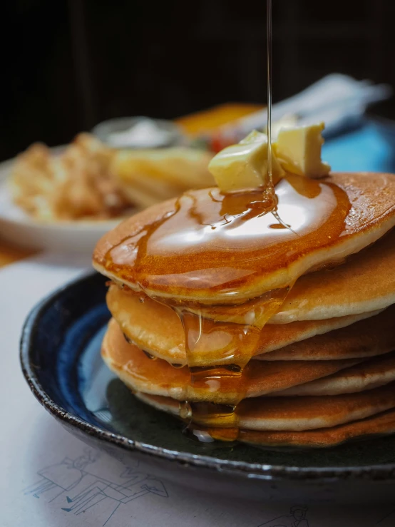 a stack of pancakes with syrup on top