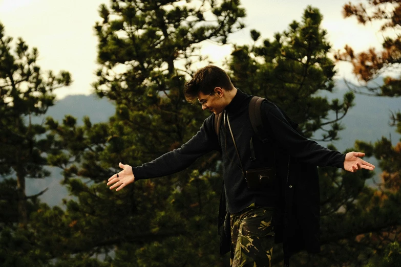 a  riding a skateboard in the wilderness