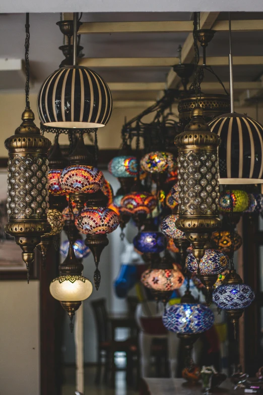 a number of colorful light fixtures in a store