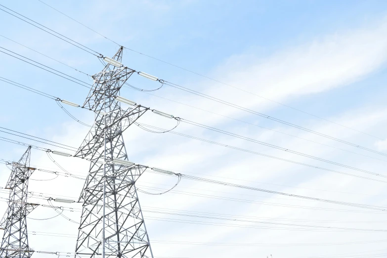 the power poles are under the blue sky