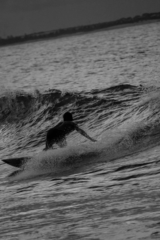 a man that is in the water with a surfboard