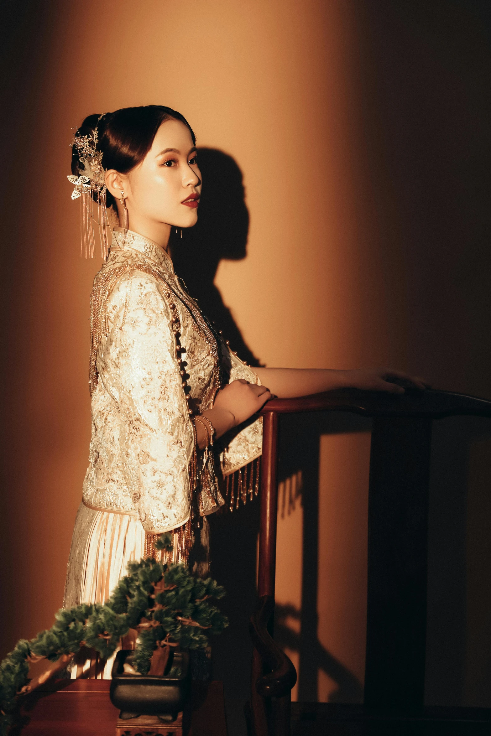 a young lady is wearing a dress with an embroidered pattern and holding a small basket