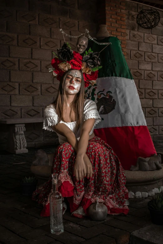 a woman in a costume with a red hat and a green and white flag