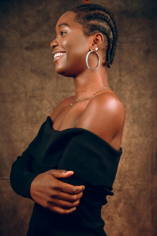 an african american woman posing in a black top