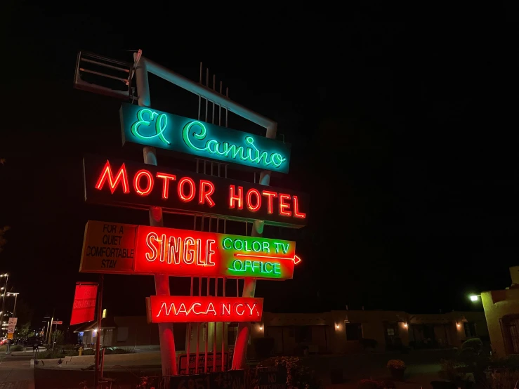 the neon signs show different directions for business