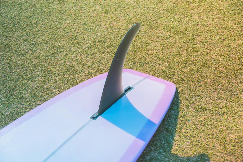 an upside down surfboard with the end on it