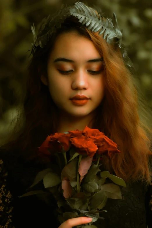 a woman holding a rose in front of her face