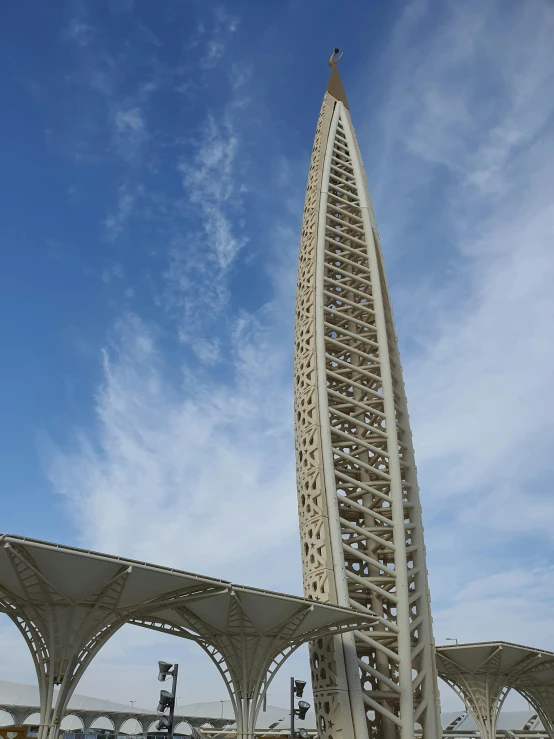 a long white structure has a sky background