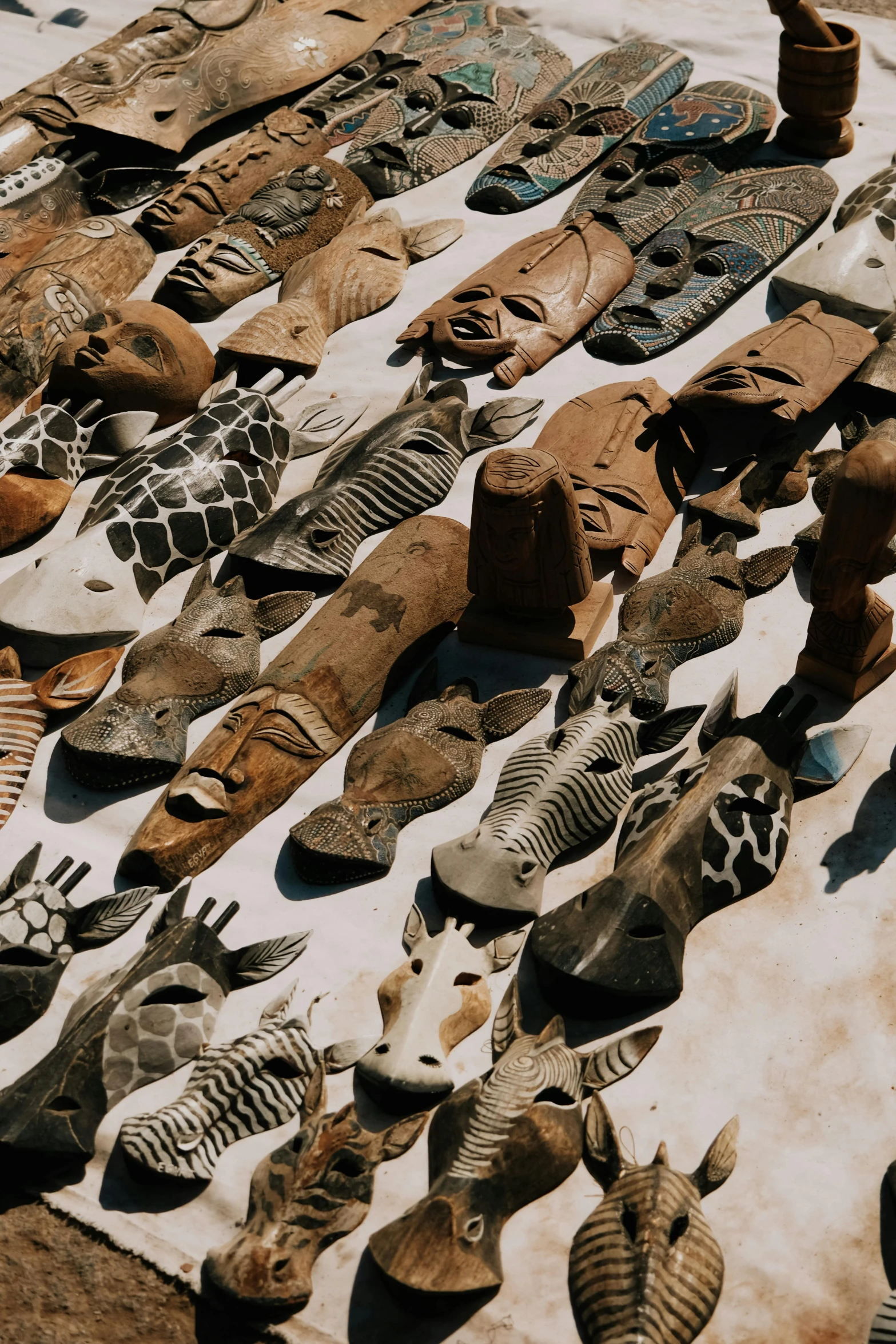 there is lots of shoes laid out on a beach