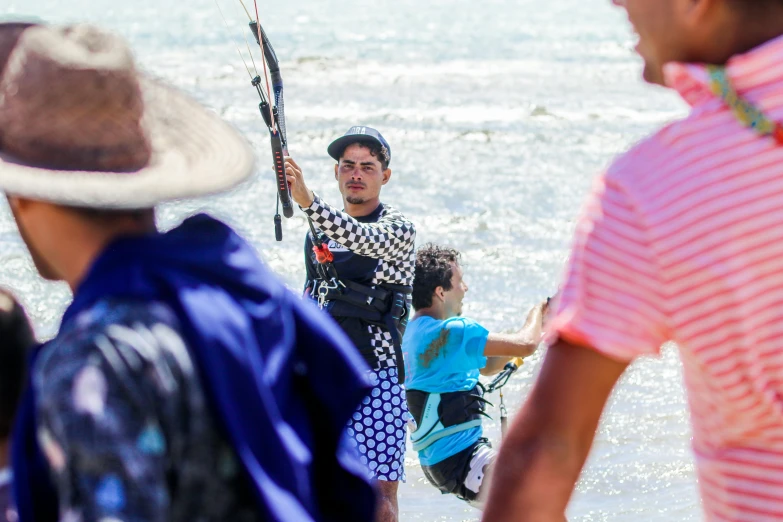 a boy is holding some kind of fishing rod