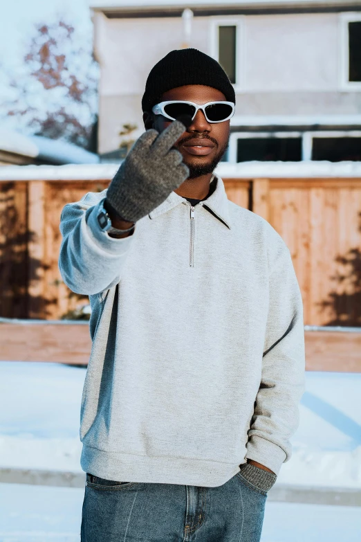 a man with sunglasses on talking on his cell phone