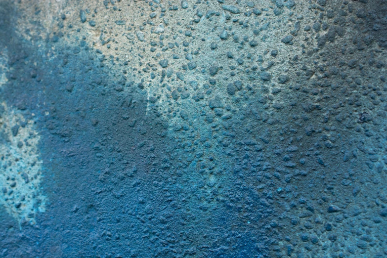 the texture of water and sand in a blue hued area