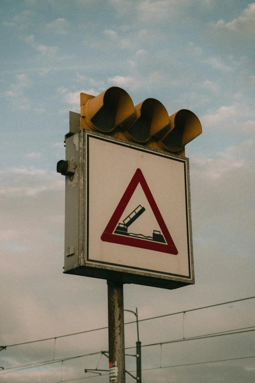 a sign that warns of vehicles on the road