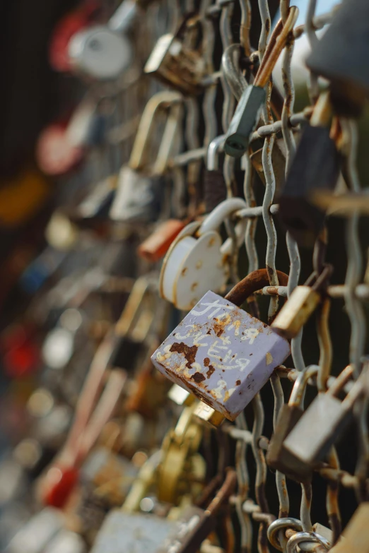 a row of locks on a chain link fence