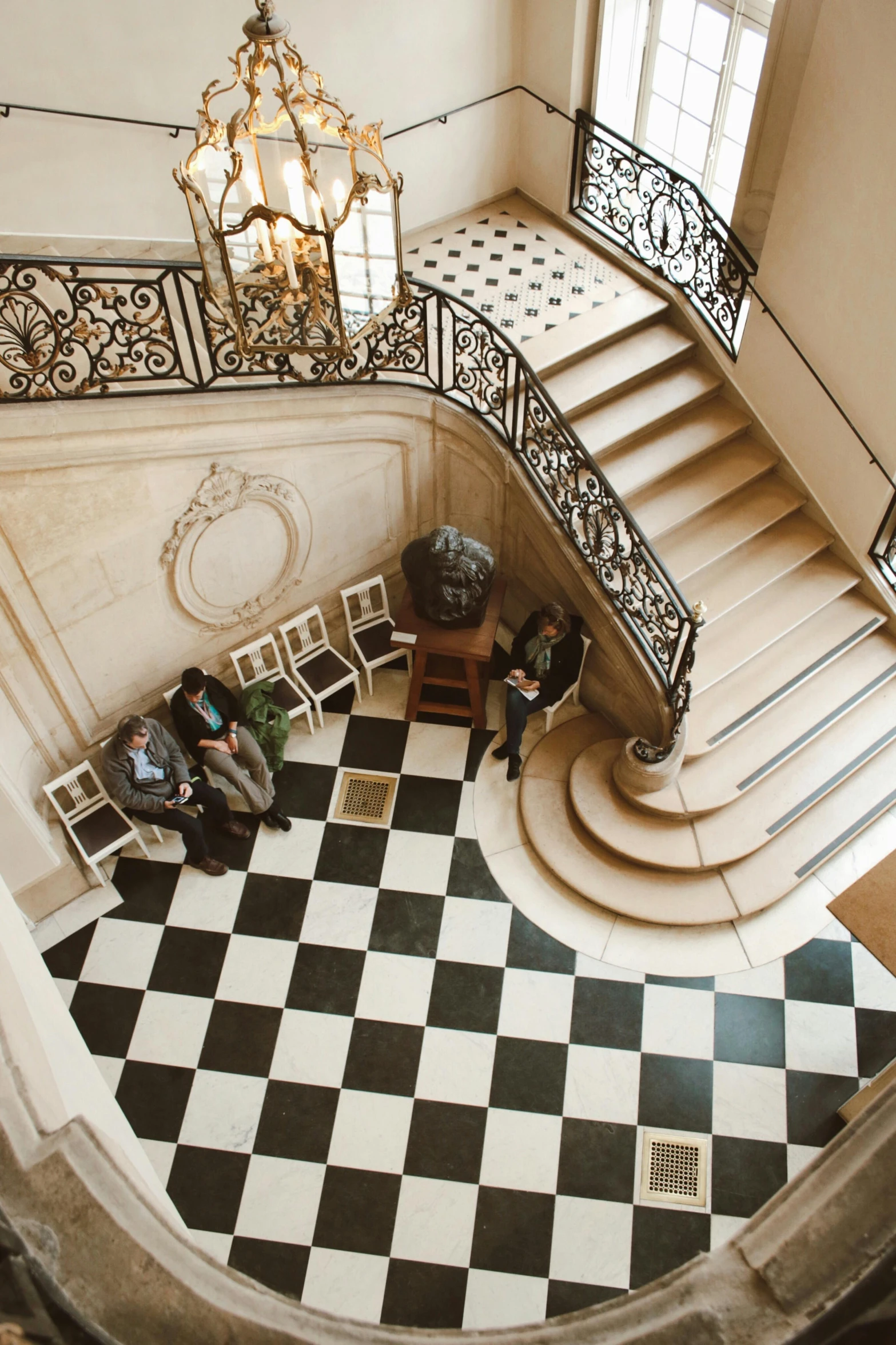 the stairs and foyer in a classic building