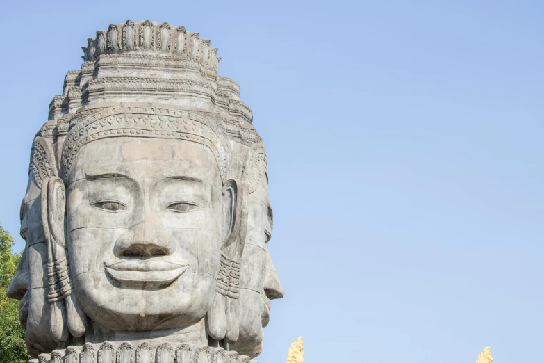 a statue made of stone sits outside