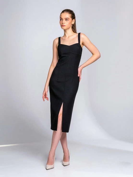 a women's black dress with a side split