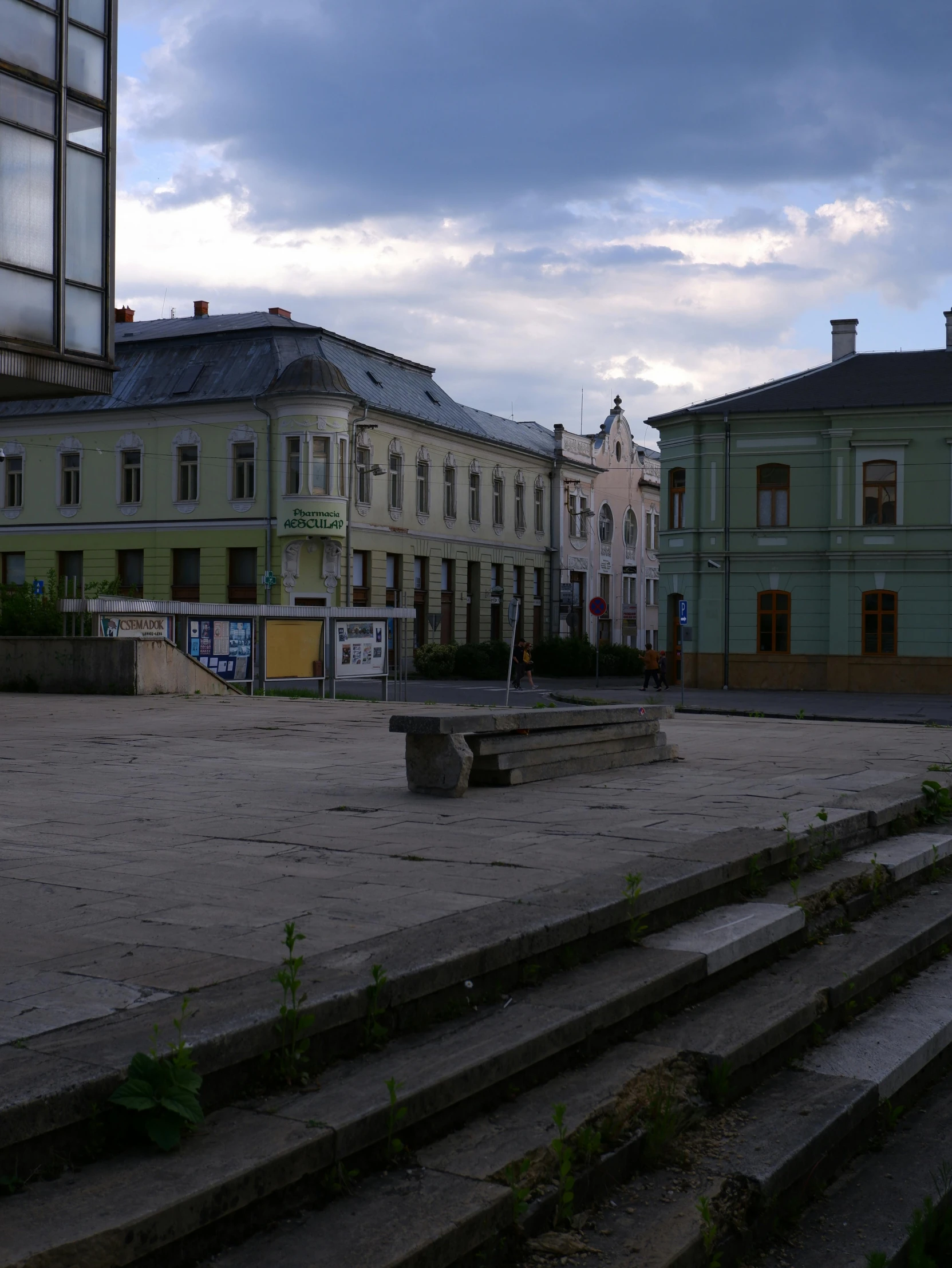 a stone stairs lead to some buildings