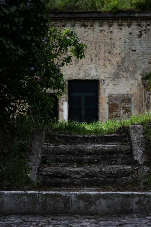 a very old building with steps leading up to it