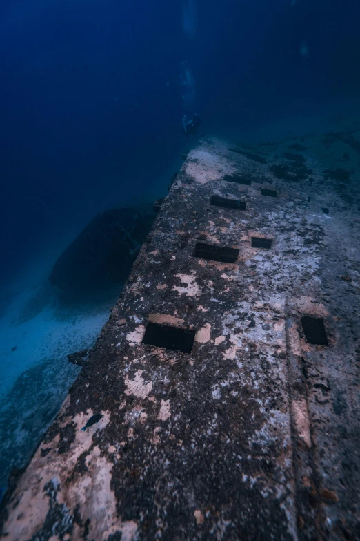 a large ship wreck with the water and sky