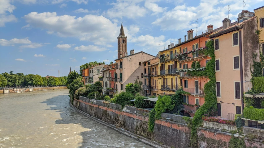 there are many buildings along the canal