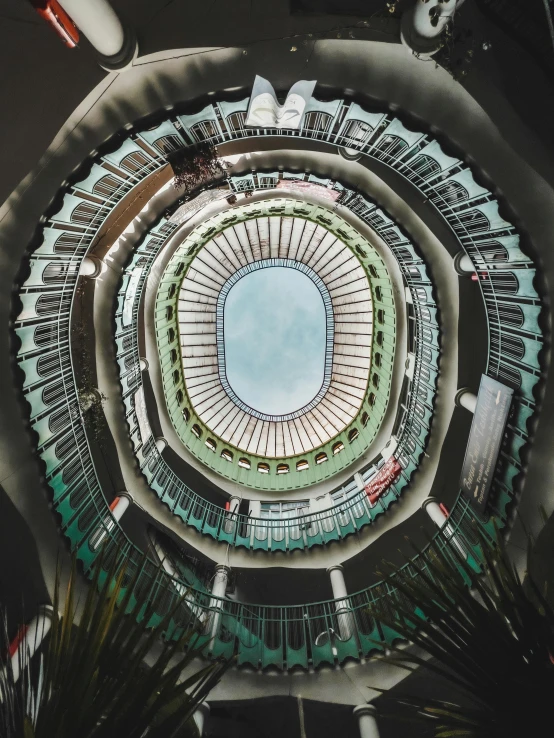 a circular mirror image that is showing a building