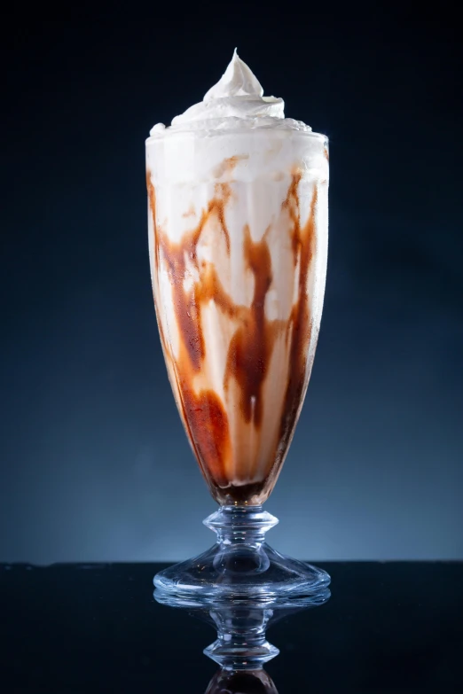 a drink is garnished with whipped cream