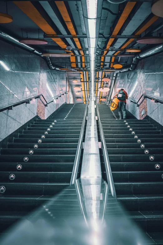 a man stands in the middle of an empty subway