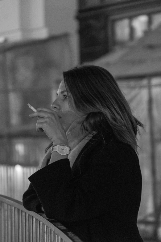 woman smoking in an old - fashioned building alone