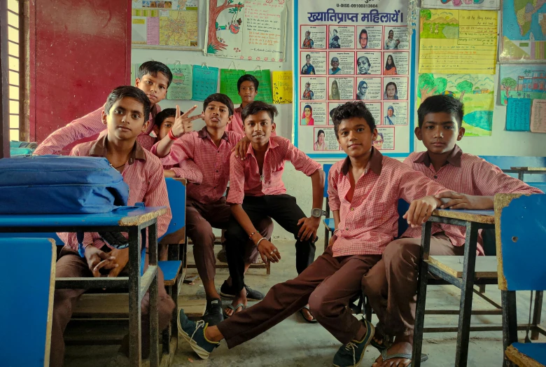 a group of boys who are in a classroom