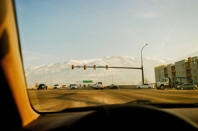 a stoplight that is over the top of a highway