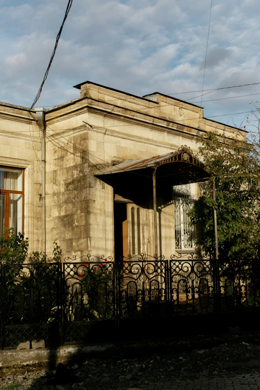 old, abandoned looking building with iron fencing