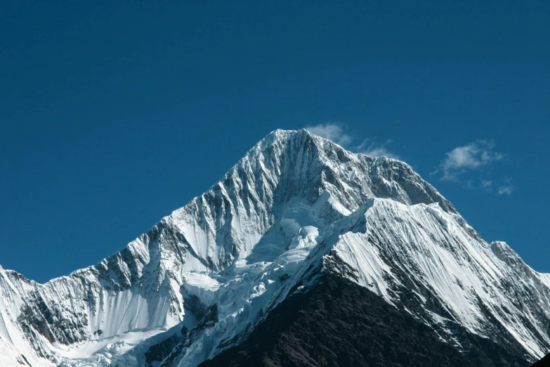 the tall mountain is covered with snow