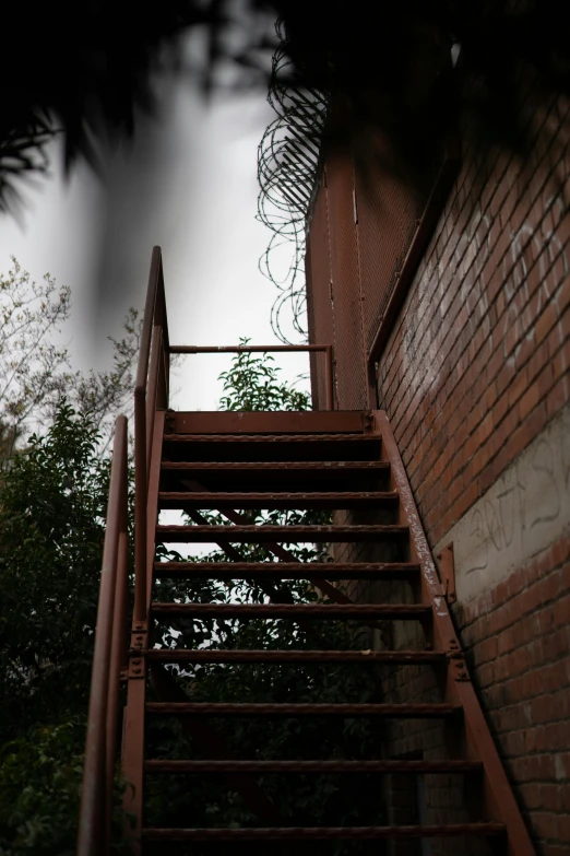 a view of an up close staircase to an outdoor fire escape