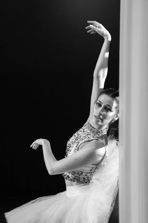 a woman is doing ballet in a black and white po