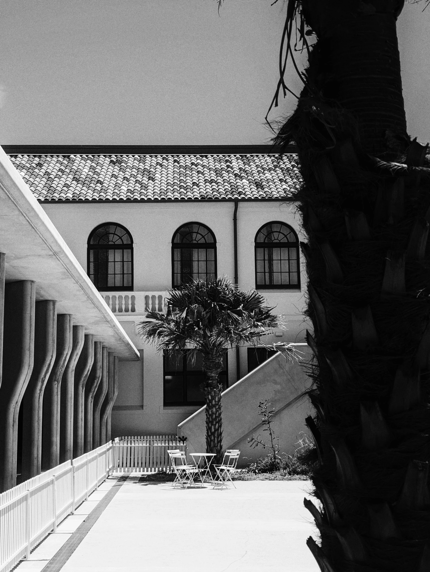 an outside building and stairs that have railings in front