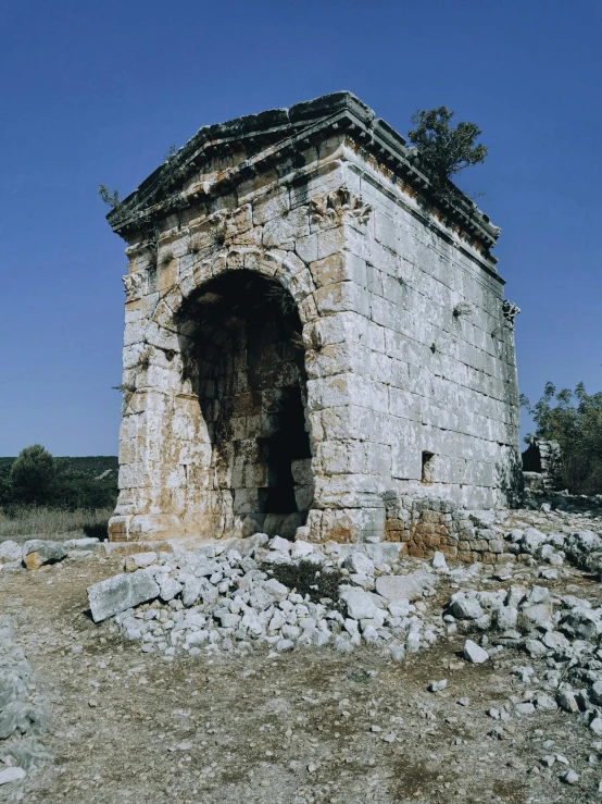 a small structure is covered in many rubble