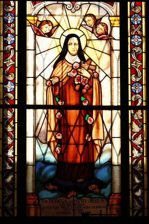 a stained glass window features a person wearing a cross
