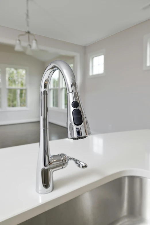 there is a sink in the middle of a kitchen